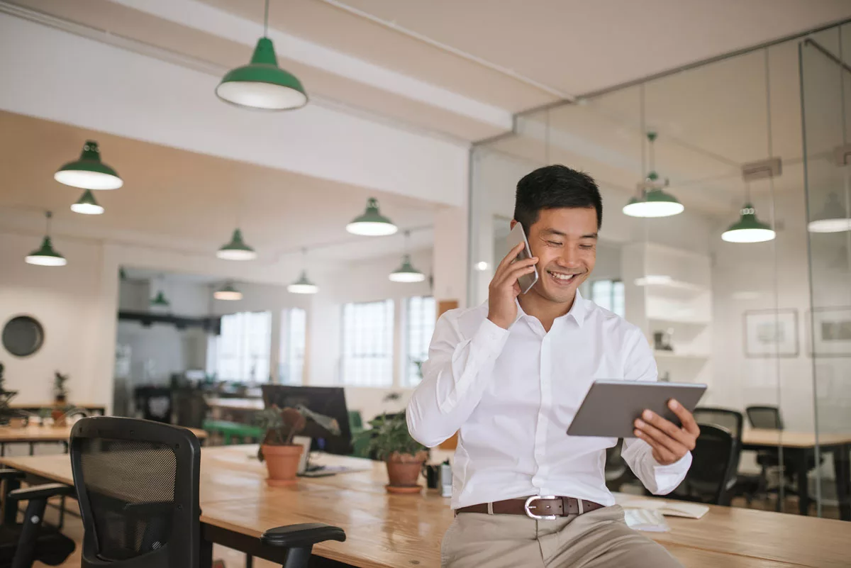 Smiling-Man-On-Tablet